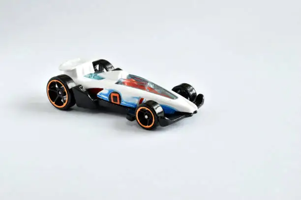 A copy of a racing car on a white background, a children s toy.