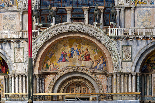 Old town of Italian City of Venice with facade of cathedral with painting at Piazza San Marco square on a summer afternoon. Photo taken August 6th, 2023, Venice, Italy.