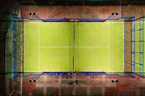 Overhead view of a Padel Tennis court illuminated at night