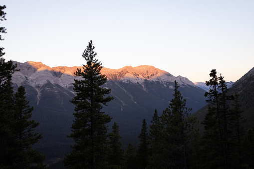Morning alpenglow in the mountains of Kananaskis Country near Canmore and Banff National Park in Alberta.