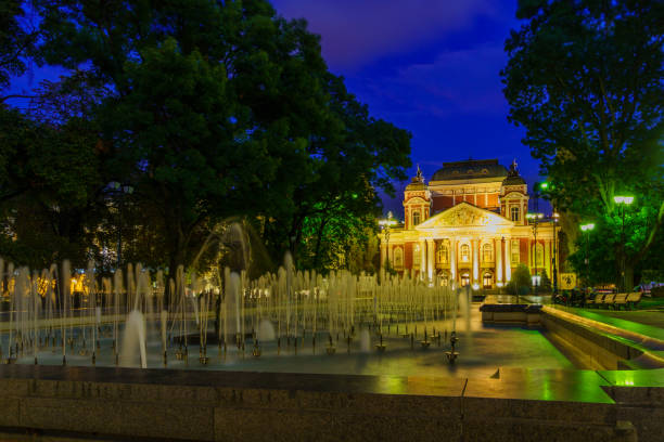 Sofia, Bulgaria - October 08, 2023: Evening view of the Dancing Ballerina fountain, Ivan Vazov National Theater, Locals and Visitors, in Sofia, Bulgaria