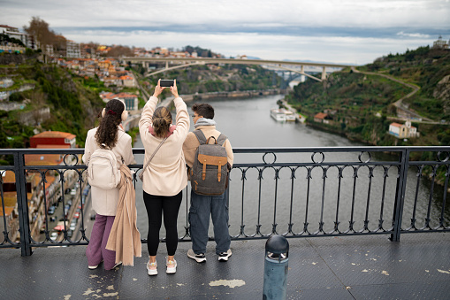 Tourists on the D. Luís I Bridge in Porto, Portugal