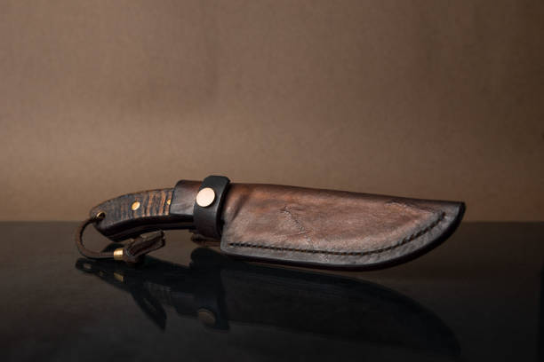 istock A hand-forged knife with a black horn handle in a leather sheath 1922757006