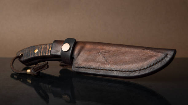 istock A hand-forged knife with a black horn handle in a leather sheath 1922758063
