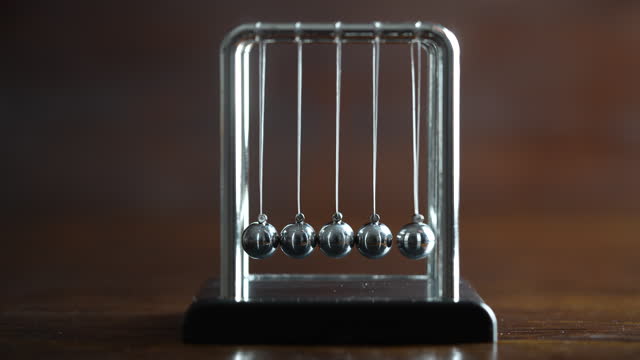 Newton cradle placed as representation momentum concept, balance balls