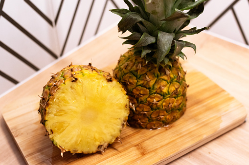Fresh cut pineapple on a cutting board in the kitchen.