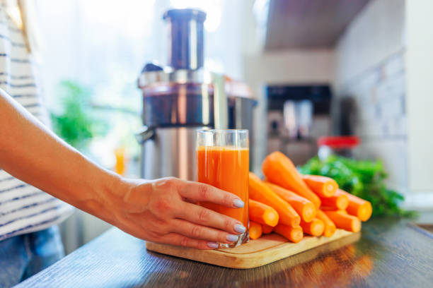 istock Fresh Homemade Carrot Juice in Kitchen Setting 1922804693
