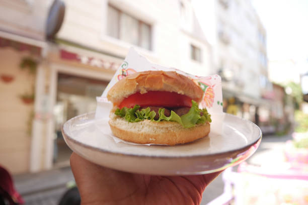 istock Cheeseburger With Salad And Tomato on a plate at outdoor 1922810919