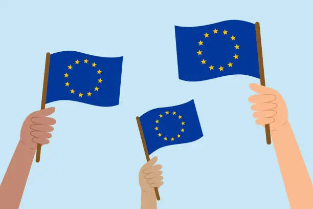 Vector illustration of Diverse hands raising flags of the European Union. Vector illustration of the EU flags in flat style.
