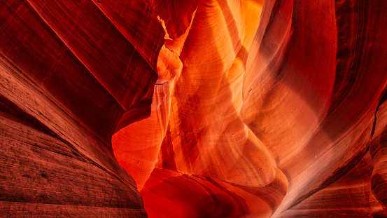 A scenic Antelope Canyon with rainbow rays on the sandstone