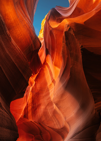 A beautiful abstract landscape of Antelope Canyon with rainbow rays on the sandstone