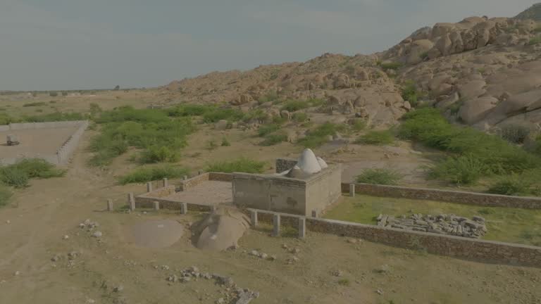 Aerial shot of ruins of Hindu temple in Nagarparkar surrounded by stones in Pakistan.