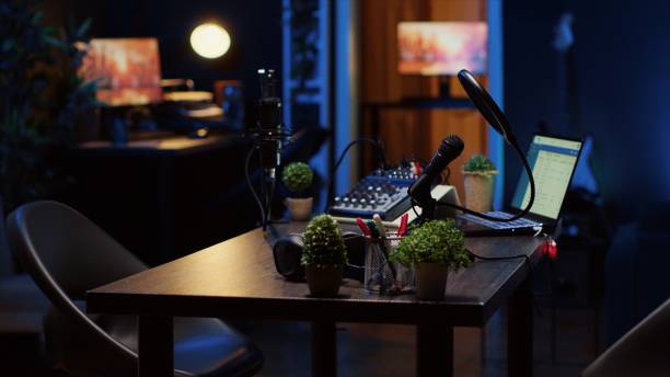 istock Empty desk in home production studio with podcast equipment technology 1922908470