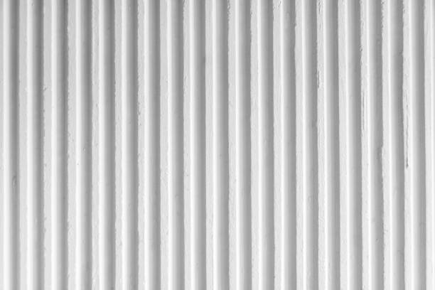 istock Old white concrete background wall with vertical line ribbed. Stripes as a texture. 1922911377