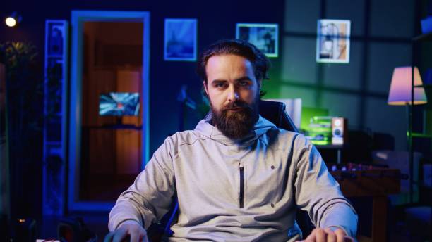 istock Professional gamer engaging in online competitive multiplayer match using cutting edge gaming setup 1922935339
