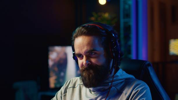 istock Upset gamer yelling and smashing table after losing online competitive multiplayer match 1922952254
