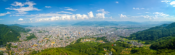 Nagano City, Japan with cityscape panorama from Asahi Mountain.