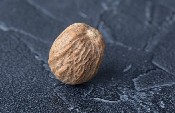 istock large dry nutmeg closeup on dark background 1922963788
