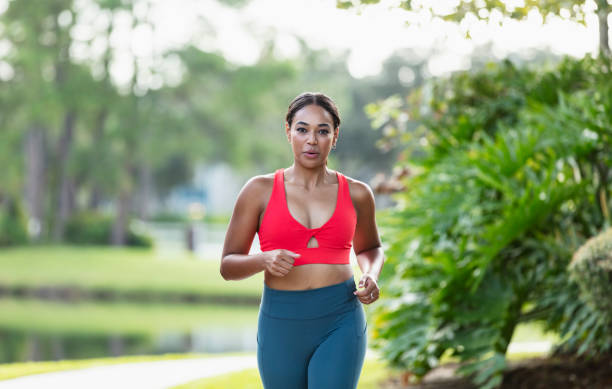 istock Young multiracial woman running or jogging 1923005461