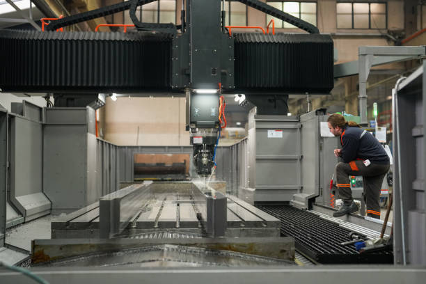 istock Technician man checking the operation of cnc machine in industry 1923053052