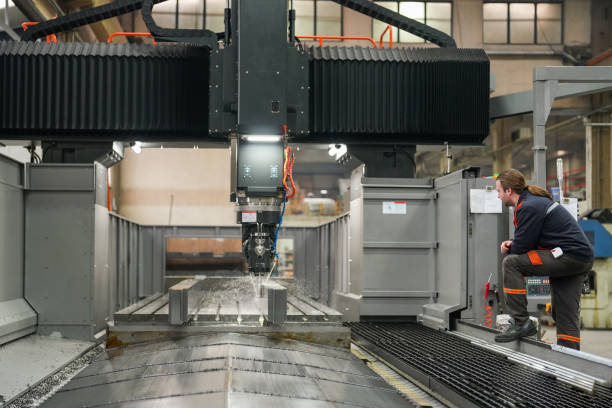 istock Technician man checking the operation of cnc machine in industry 1923053066