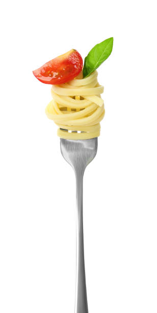 istock Fork with tasty pasta, piece of tomato and basil isolated on white 1923061961
