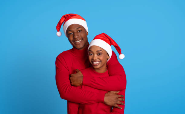 istock African American couple embracing warmly against blue studio background 1923100861
