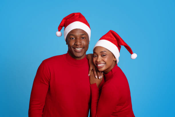istock Black woman and man sharing hug over blue studio background 1923100864