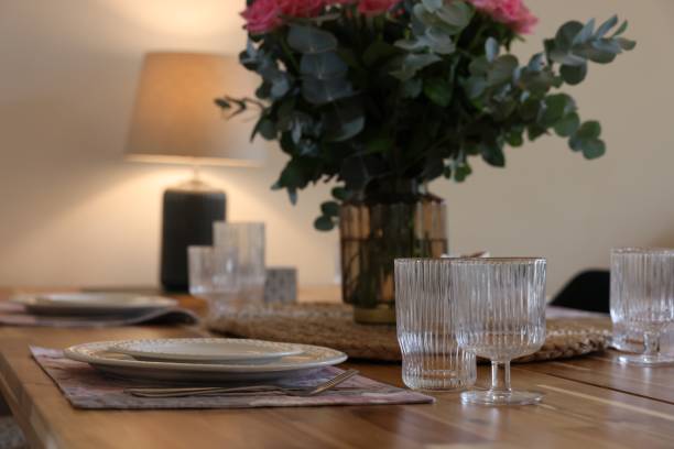 istock Beautiful table setting. Plates, cutlery, glasses and napkin indoors 1923117566