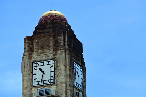 Old clock face isolated, roman numerals, about twelve