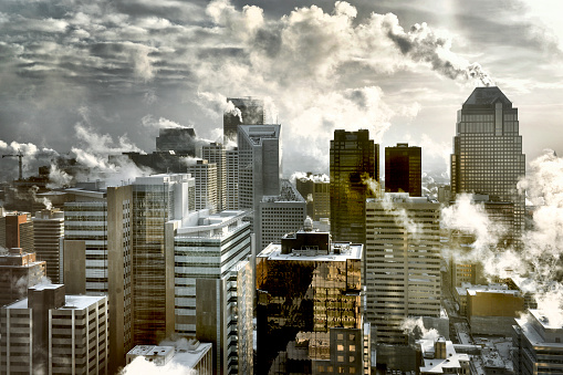 A scenic view of a frosty winter skyline of a city with various high-rise buildings