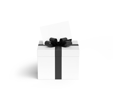 Black gift box with gold satin ribbon bow, over white background.