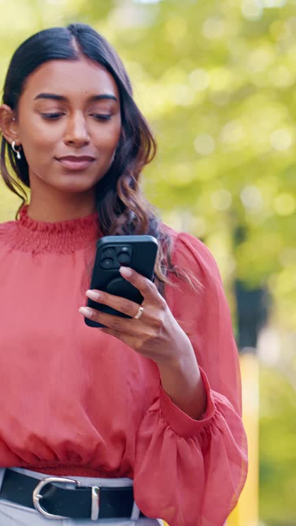 Walking, business and outdoor with woman, smartphone and typing with connection, sunshine and network. Person in a city, employee or consultant with a cellphone, mobile user and social media with app