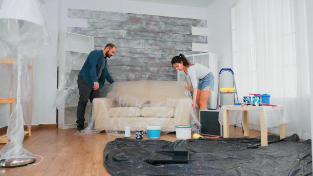 istock Married couple covering sofa 1923184458