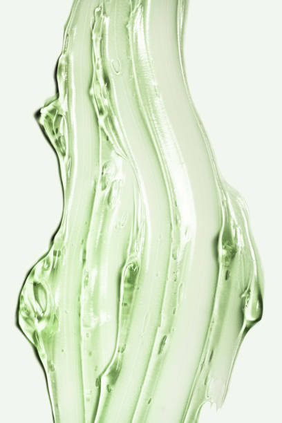 istock Cosmetic aloe texture. Gel smudge swatch on gray background. 1923193383