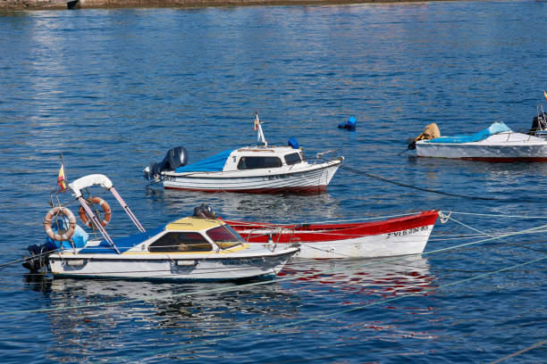 The beautiful image of the anchored boats gives a feeling of peace and tranquility