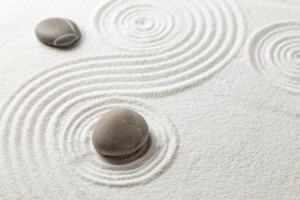 Zen garden Zen garden with the stones and white sand pattern spiral rock stock pictures, royalty-free photos & images
