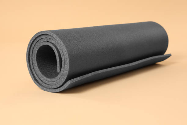 istock One grey yoga mat on beige background 1923264055