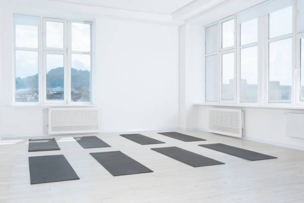 istock Spacious yoga studio with exercise mats and big windows 1923266145