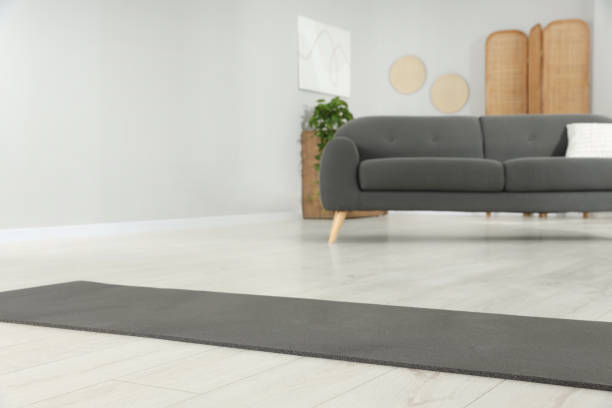 istock Grey yoga mat on floor in room 1923266153