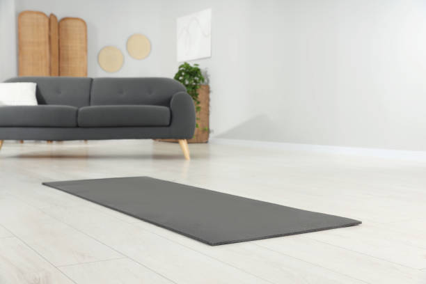 istock Grey yoga mat on floor in room 1923266155