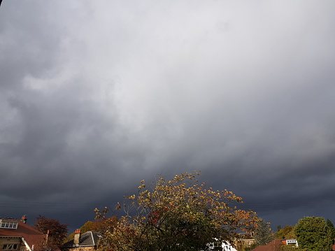 Cloudy dark moody weather over the city, Glasgow Scotland England UK