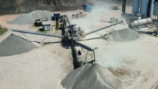erial view of a cement plant at a quarry for the construction industry. Conveyor belt of heavy machinery loads gravel.