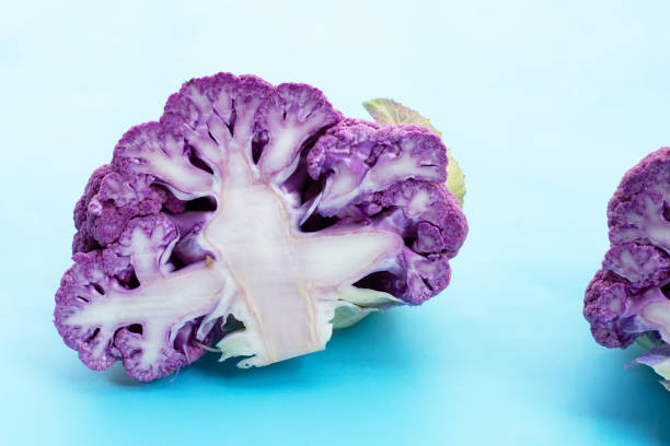 istock Purple cauliflower on blue background. 1923334786