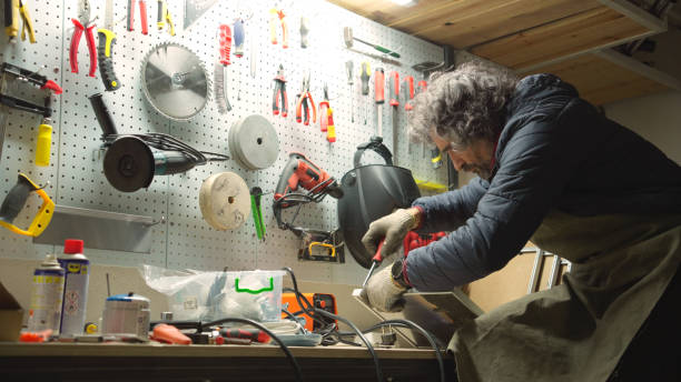 istock Carpenter working late in his workshop. Small business owner. 1923401718