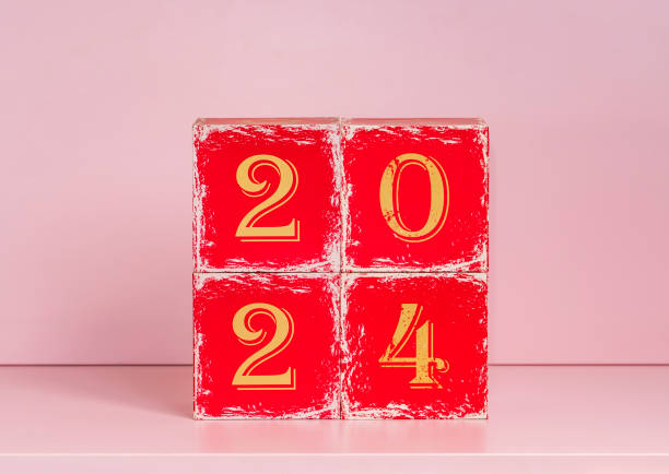 istock 2024 year concept red blocks on pink background 1923413522