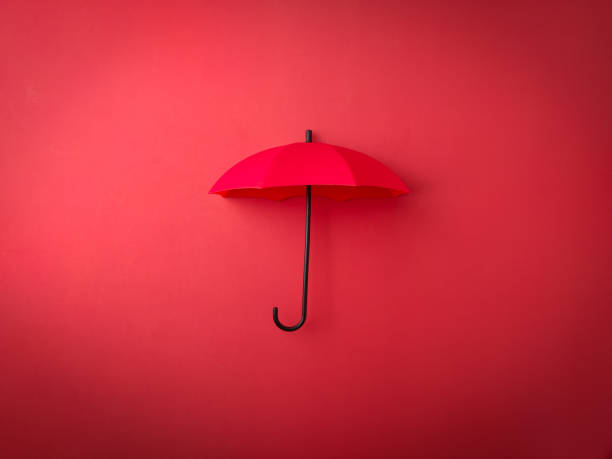 istock Top view red umbrella on a red background 1923435340