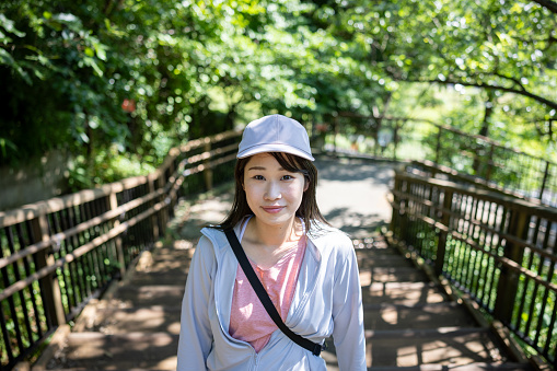 Portrait of female hiker on steps in public park