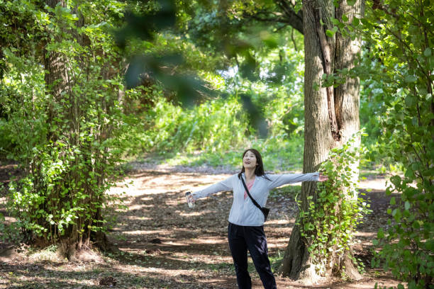 istock Female athlete deep breathing in nature 1923441507