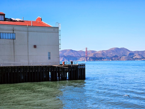 View of Fort Mason Center in San Francisco California from the pier with the Background of Golden Gate Bridge